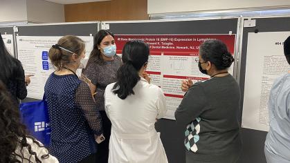 Student presents her poster