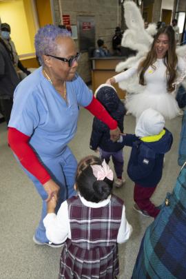 Staff dancing with children