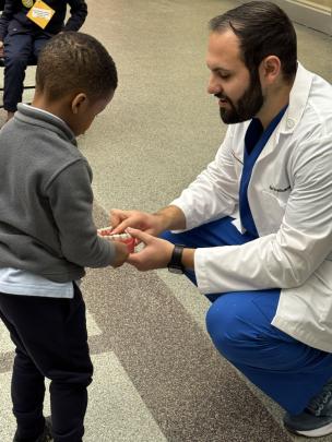 A student speaking with a child